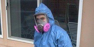 Mold Cleanup Technician In Full Gear